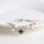 Bracelet En Corde Avec Planète Saturne Pour Un Look Tendance