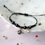bracelet fantaisie planete avec anneau dore et perles colorees 603 1 1